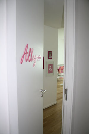 Allegra's name on the nursery door in pretty pink perfect for a baby girl
