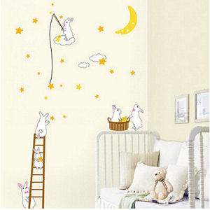 Cute bunny rabbit wall decals and stickers in a neutral yellow pink and white moon and stars theme baby nursery