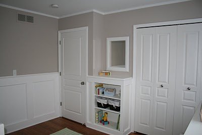 The true white traditional wainscoting in the baby's nursery.