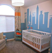 Baby cityscape nursery room with a city skyline wall mural in blue