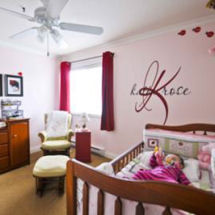 Red and gray baby girl ladybug nursery with large wall name decal