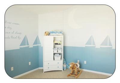 Nautical baby nursery theme decorated with sailboats wall stencils, boat crib bedding and quilts