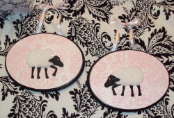 3D White, pink and black baby lamb wooden nursery wall plaques with damask print background.