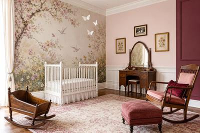 Abby's elegant butterfly nursery with a watercolor meadow mural, white crib and antique furniture