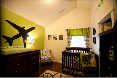 Modern green and brown airplane theme nursery room decor