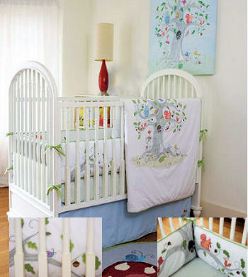 Baby bedding with forest creatures squirrels acorns birds and a tree with leaves sheltering the baby animals