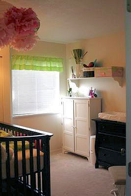 I made the pom poms in the cluster over our baby girl's bed and her grandma made the nursery window valance. 