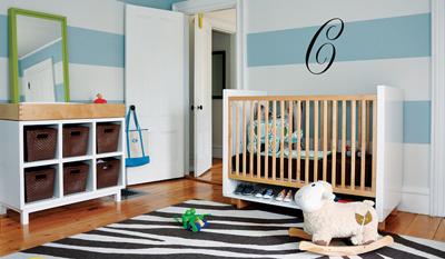 Modern baby blue and white nursery room decor with horizontal wall stripes