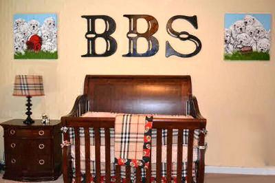 Football sports theme nursery for a baby boy with a Burberry plaid crib bedding set and wooden wall letters by Murals & Things by Jamie