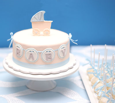 Homemade baby carriage baby shower cake picture idea for a boy party with decorations