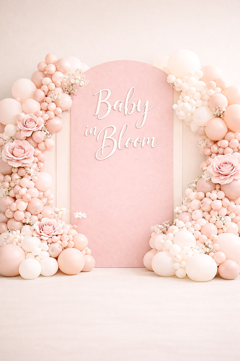 Baby in bloom baby shower backdrop with layered panels, balloon clusters, and oversized flowers