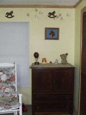 The stenciled rocking horse wall border over the baby dresser that was mom's. 