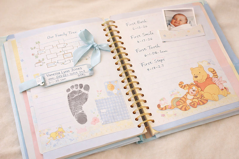 Baby memory book with keepsake pages and handwritten notes