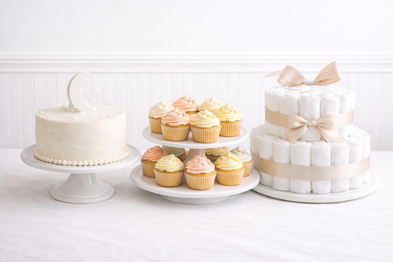 Elegant baby shower cake ideas with a styled dessert table in soft pastel colors