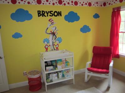 Our baby boy's name, blue cloud shaped wall decals, Cat in the Hat and Thing One and Thing Two are the focal point of the nursery over our baby boy's changing table.