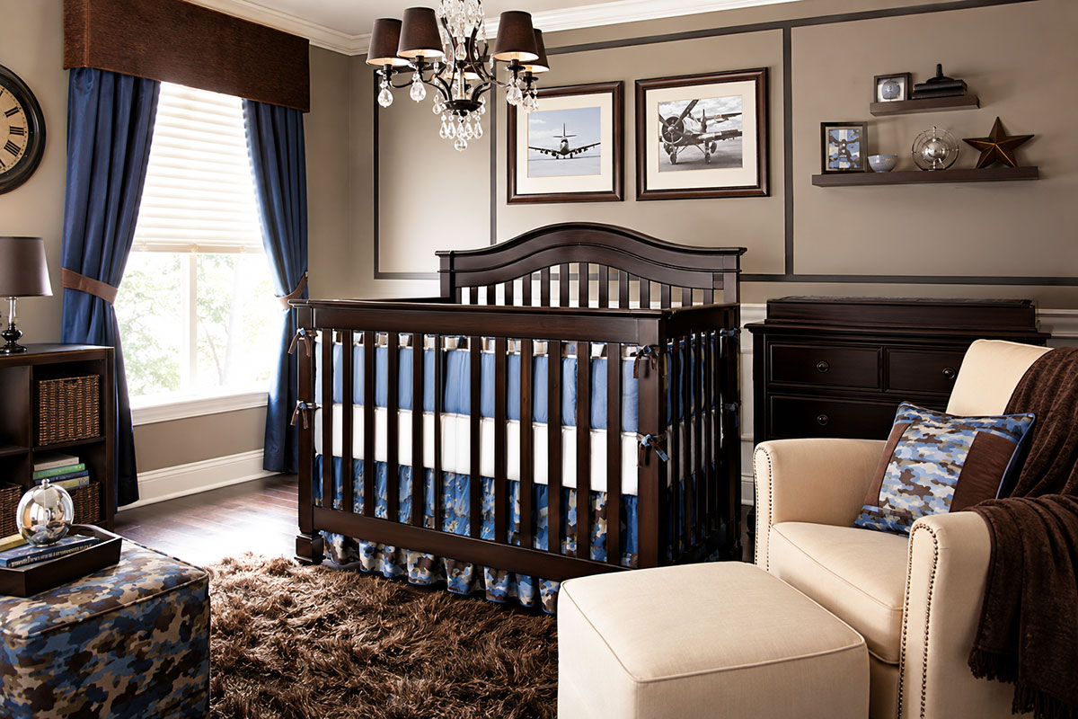 Blue and brown camouflage baby nursery with aviation-inspired decor