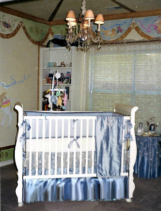 Carousel horse baby nursery theme room for a baby boy with custom wall mural created by Lynda Bergman