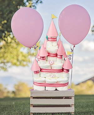 Princess castle diaper cake for a girl baby shower party.