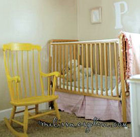 Pink, taupe and yellow baby girl nursery room design with an old rocking chair painted yellow