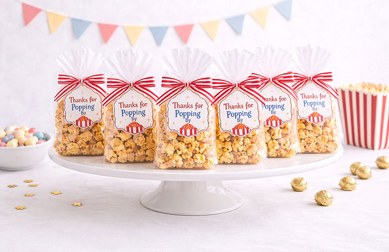 Circus baby shower favors with candy containers arranged for guests