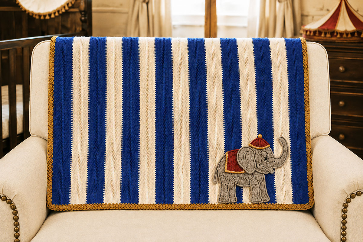 Royal blue and white crochet stroller blanket body with fourteen even stripes before the antique gold border is added