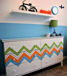 Painted chevron stripes in bright colors on a baby nursery dresser