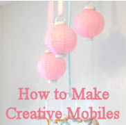 Baby crib mobile for a pink nursery made from paper party lanterns