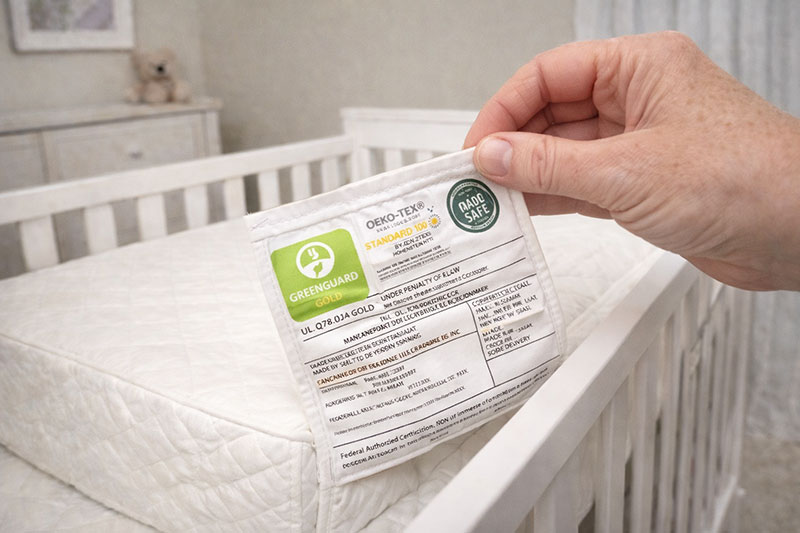 reading crib mattress certification label