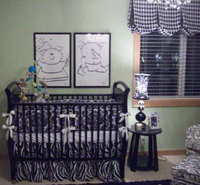 A crib painted black in a neutral theme nursery decorated for baby boy and girl  twins