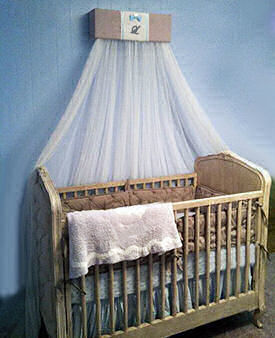 Blue and brown baby boy nursery with burlap crib canopy