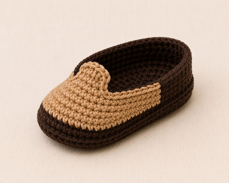 Tan rounded toe vamp with center tab on a crochet baby cowboy boot
