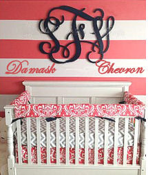 Custom baby crib bedding set in watermelon pink and white damask pattern with a white and gray chevron fitted crib sheet
