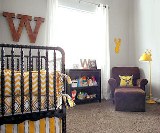 Whitetail deer themed baby boy nursery with DIY rustic decorations and custom made chevron crib bedding set
