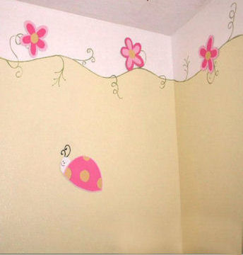 DIY hand painted pink ladybug wall border in a baby girl nursery craft project