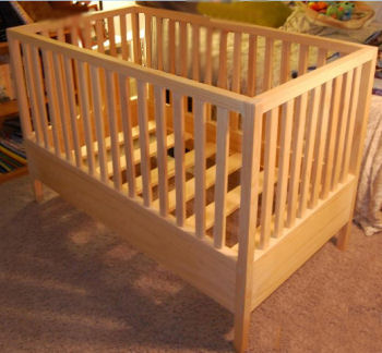 Easy wooden crib plans for a baby crib with stationery sides in the style of arts and crafts or mission furniture