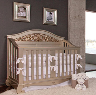 Elegant baby crib painted in metallic silver and gold paint