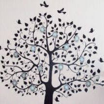 Family tree wall mural with photo frames on the branches in a baby girl nursery