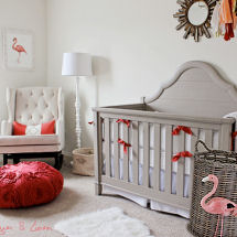 Modern flamingo nursery with a neutral color scheme decorated for a baby girl with pops of coral pink