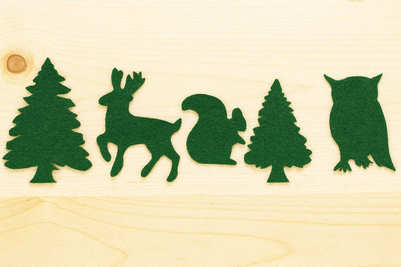 DIY woodland felt animal cutouts including trees, owl, deer and squirrel for nursery crafts