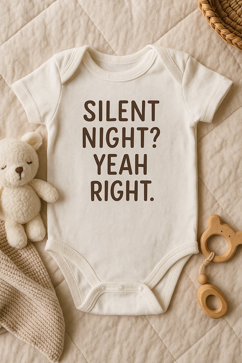 funny baby onesie flat lay with Silent Night Yeah Right saying for adorable newborn outfit photos
