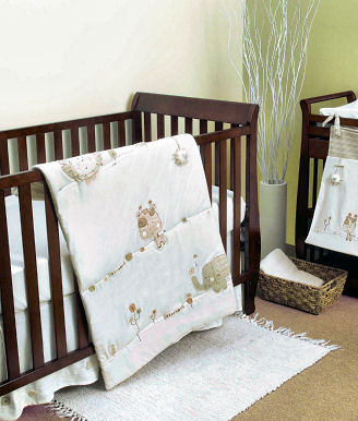 Gender neutral jungle safari nursery ideas with animals for a baby boy or girl in earth tones and antique white