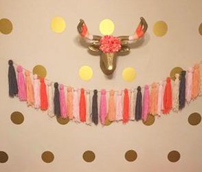 gold dots on baby nursery wall with metallic gold painted deer head and tassels garland