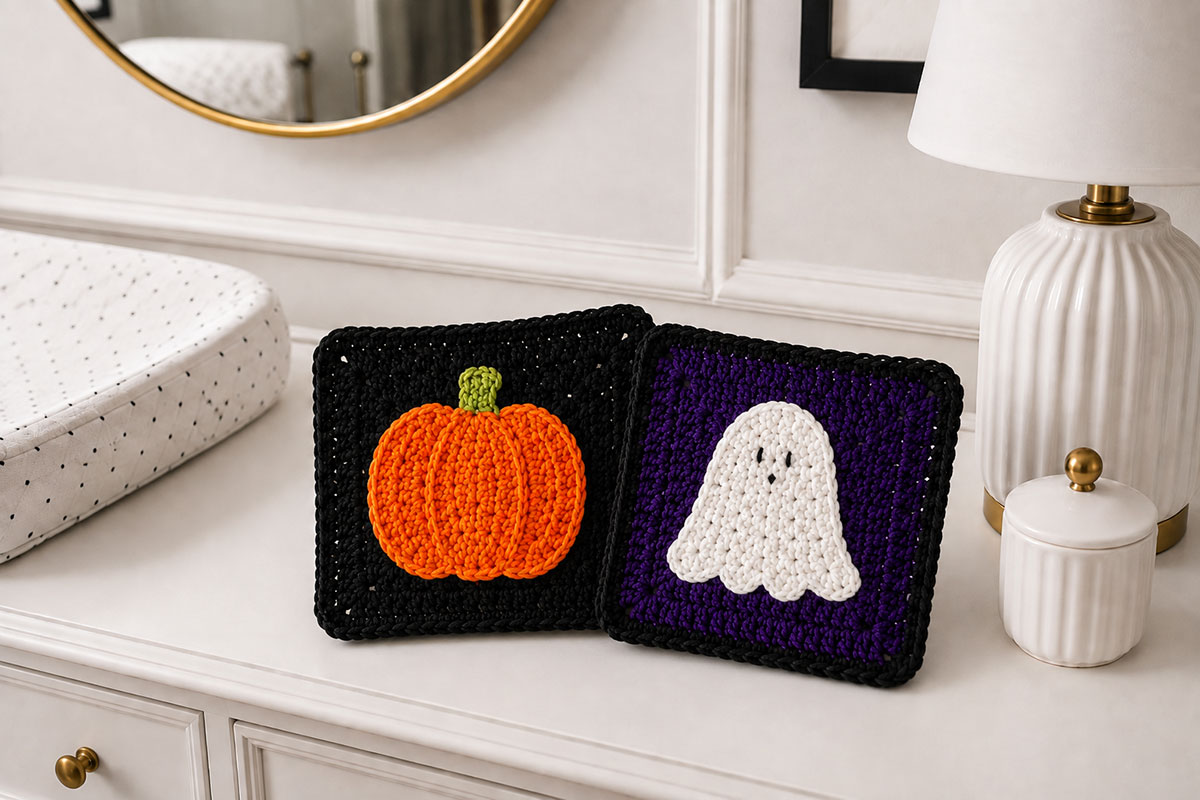 Pumpkin and embroidered ghost motifs centered on dark Halloween crochet granny squares