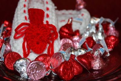 I Love Valentine's Day baby crochet ballet slippers with red crocheted hearts on the toes of the shoes