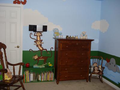 The funny monkeys that are painted on the walls of our baby boy's nursery seem to be standing on the bookshelf that my husband made for Jonas' room.