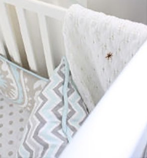 Spider inside a baby crib in the nursery