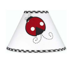Ladybug wall decals decorating a plain white lamp shade for a baby girl nursery