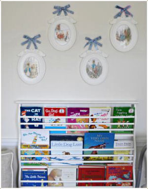 Books on display in a little prince's nursery reading nook