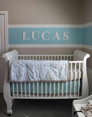 Baby boy nursery room decorated with baby blue brown and cream white horizontal wall paint stripes painting technique