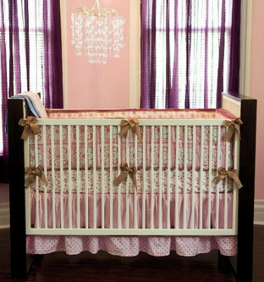 A modern boho crib set for a baby girl with vintage Moroccan influence 